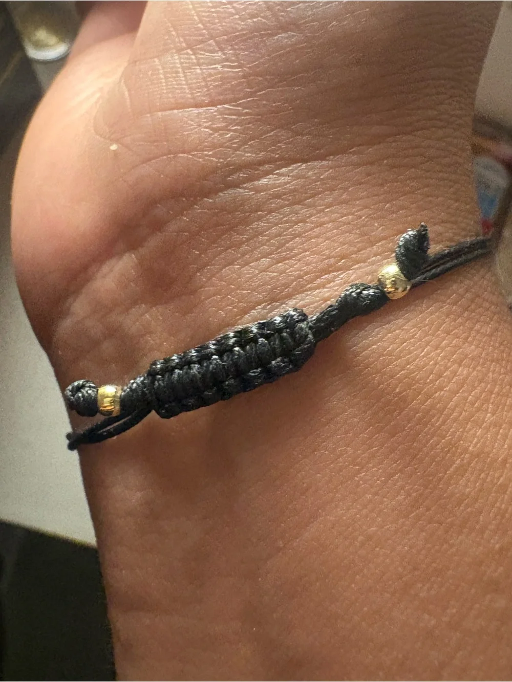 Zumba Fitness Gold Om Pendant Bracelet with Multicolor Crystals and Black Cord
